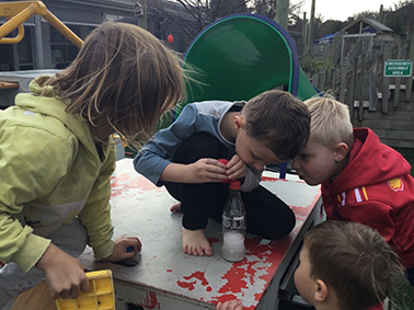 Children outdoors science experiment