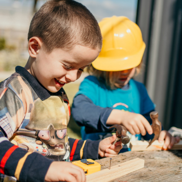 Children engaged with construction play