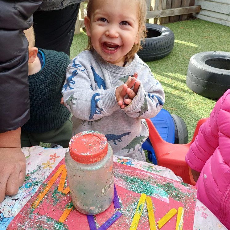 Crafting outdoors at Busy Bees Apollo Rosedale Albany Childcare 