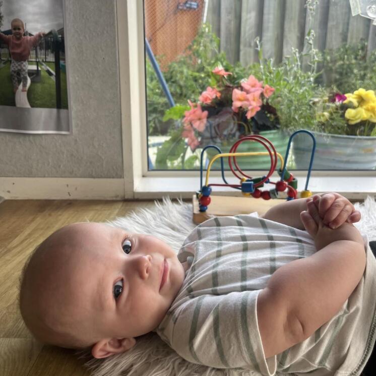 Baby in nursery room enjoying care moments at Busy Bees Ashburton