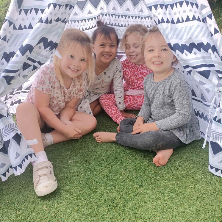 Playtime under the tent at Busy Bees Cambridge early childhood centre