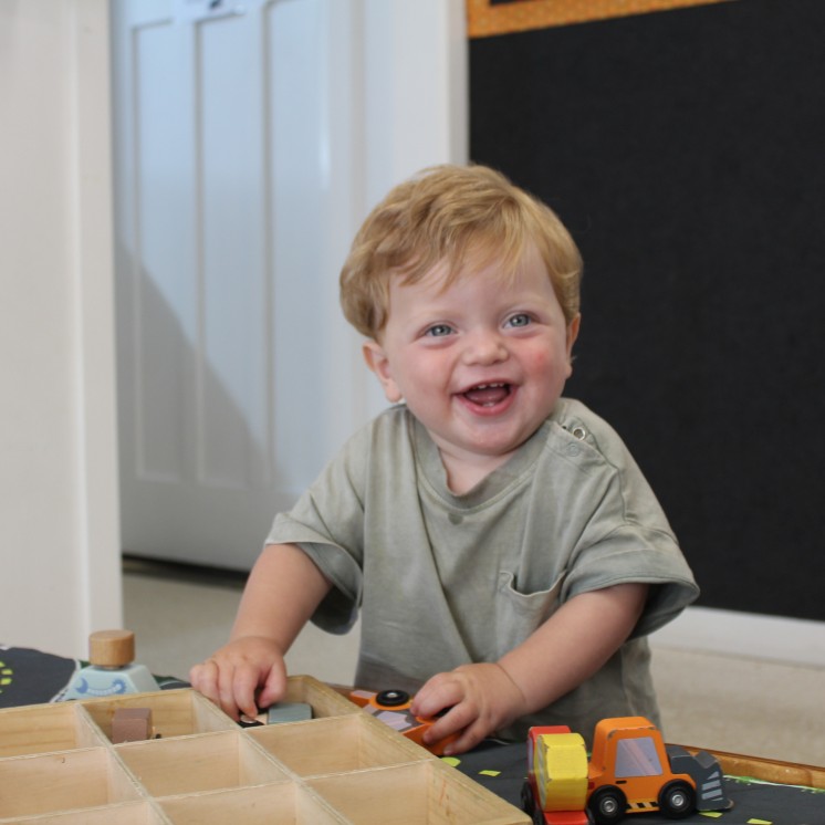Busy Bees Carterton childcare toddler playing with toys