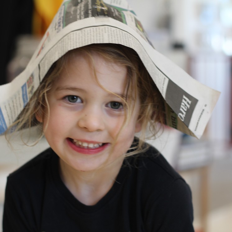 Busy Bees Carterton childcare creative play with newpapers 