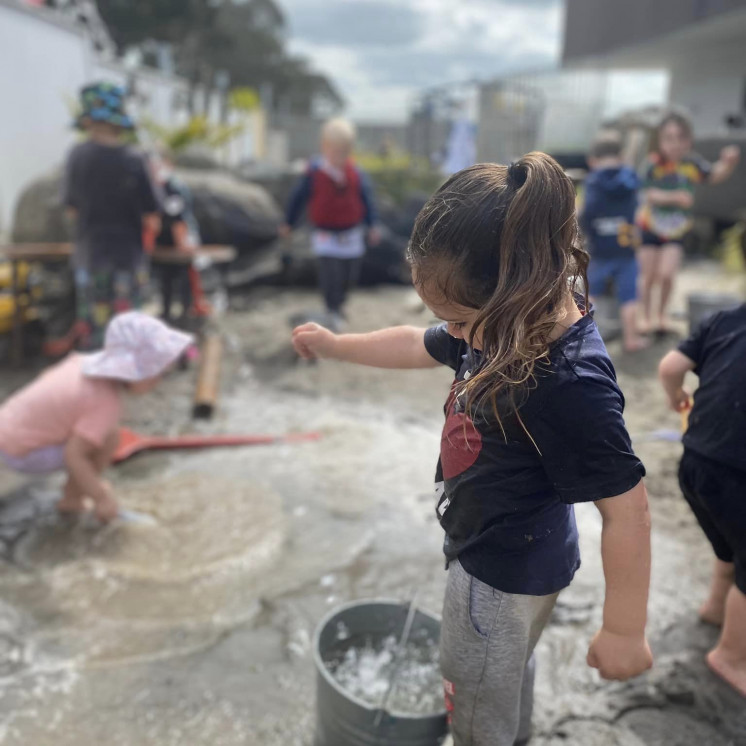 Children playing outside at early childhood centre in Palmerston North at Busy Bees on Featherston Street