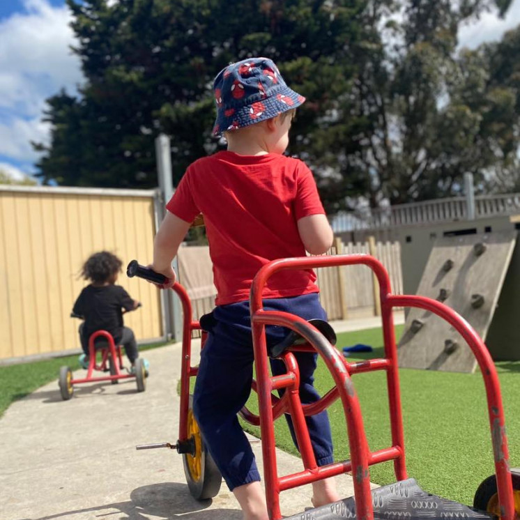 Children playing outside at early childhood centre in Palmerston North at Busy Bees on Featherston Street