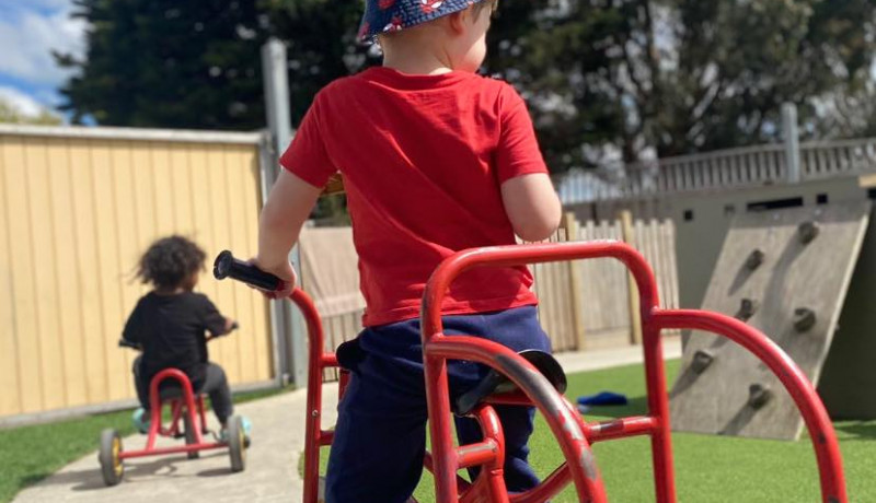 Children playing outside at early childhood centre in Palmerston North at Busy Bees on Featherston Street