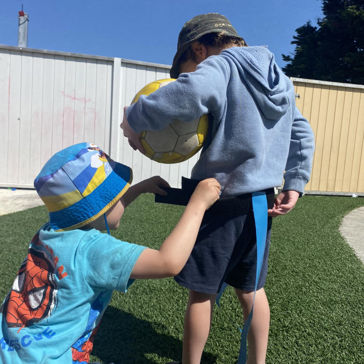 Children playing outside at early childhood centre in Palmerston North at Busy Bees on Featherston Street