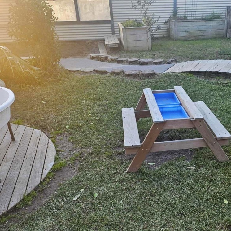 Busy Bees Grandview Road Centre building picnic table and outdoor activities