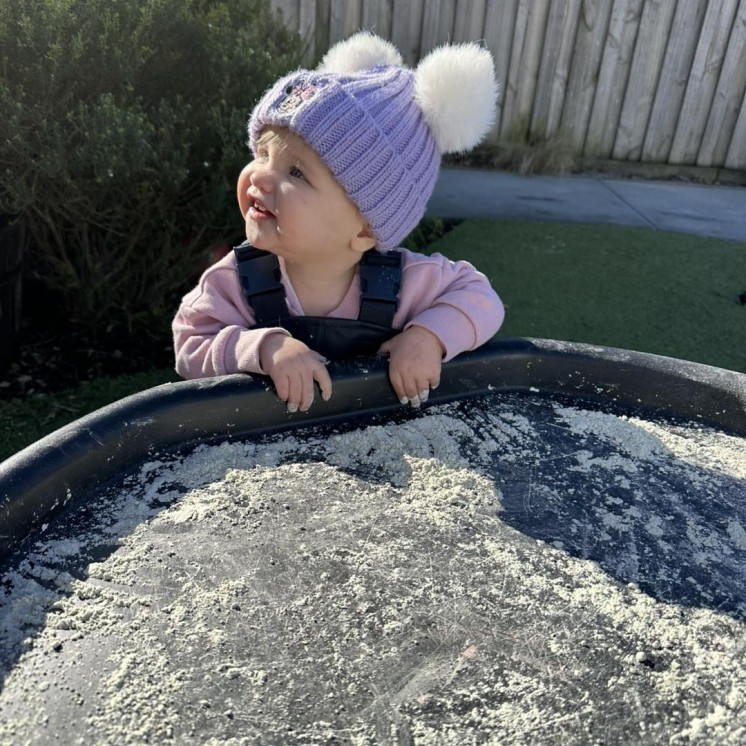 Busy Bees Hamilton East childcare centre baby outdoor sensory play