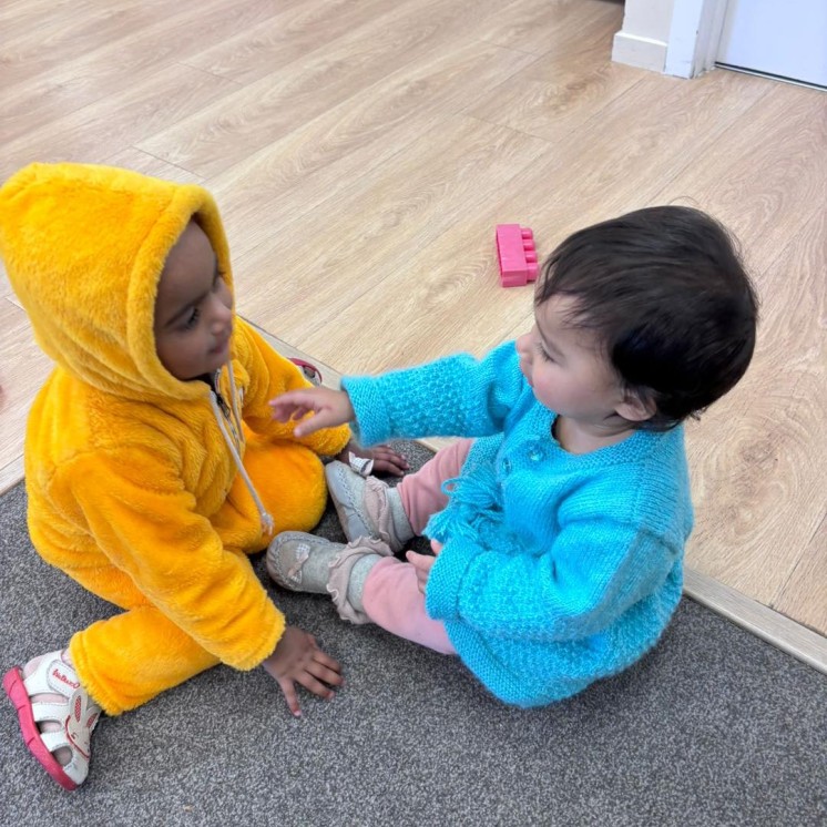 Busy Bees Hamilton East childcare centre baby room bonding socialising and growing friendship