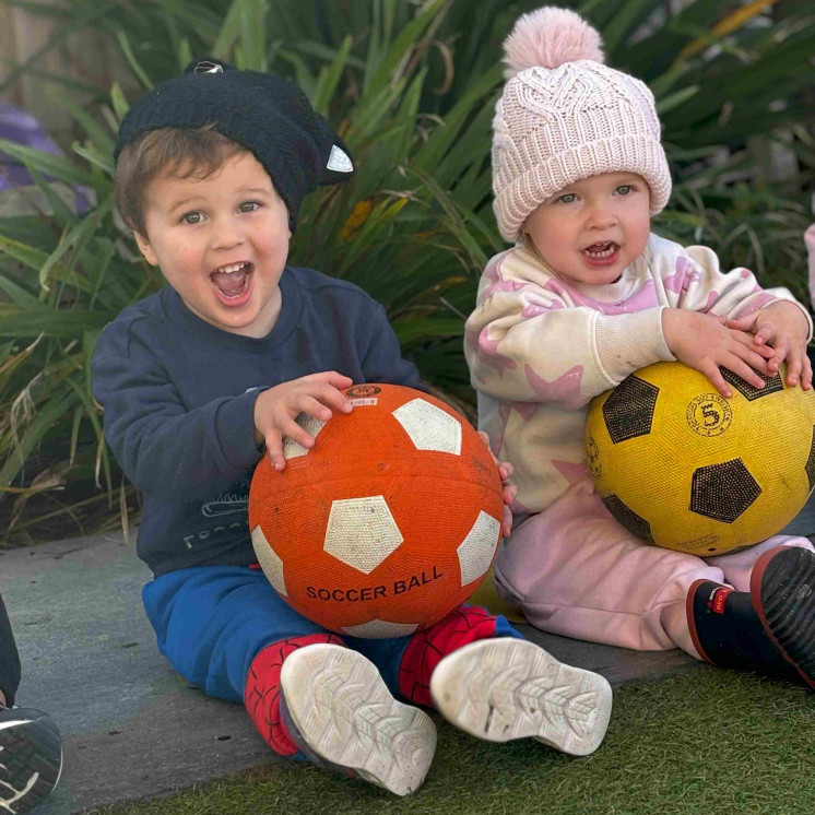 Fine motor skills with soccer balls at Busy Bees Hamilton East