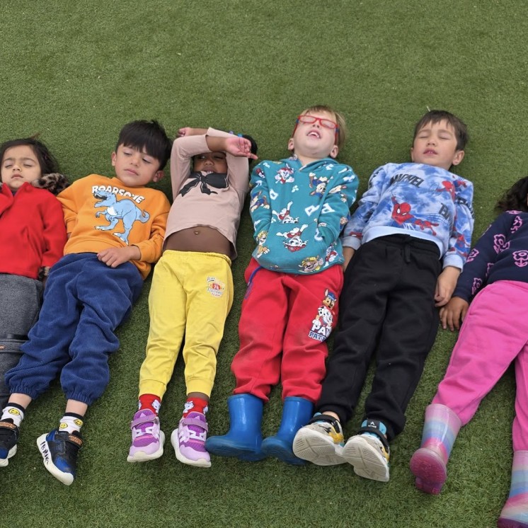 Busy Bees Hamilton East preschool outdoor sunbathing activity