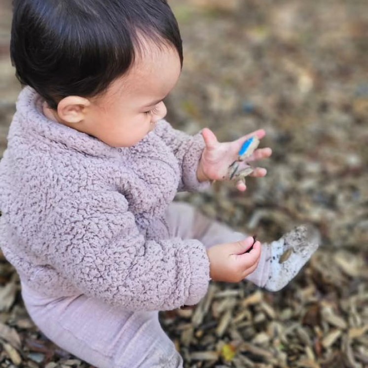 Busy Bees Hamilton East baby outdoor bark Sensory play