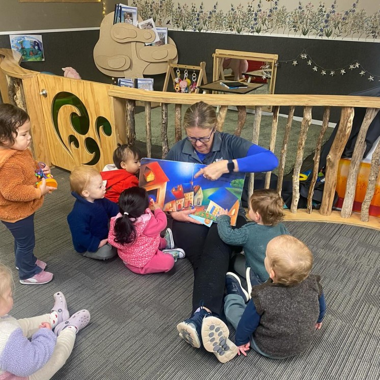 Busy Bees Hastings teacher care moment, early literacy, reading