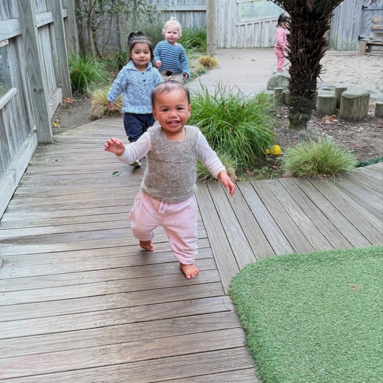 Busy Bees Hastings toddlers exploring outdoor walkways