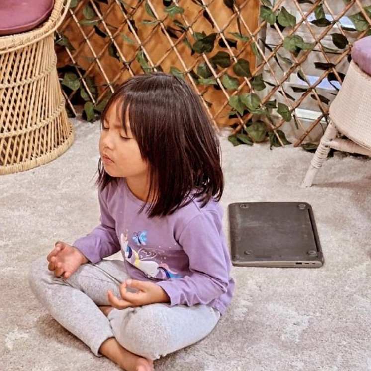 4 year old girl taking a mindfulness moment at Busy Bees Havelock North