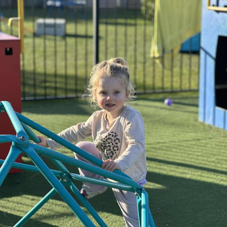 Outdoor play in preschool playground at Busy Bees Judsons Road