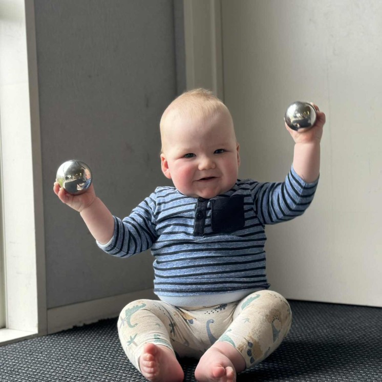 Fine motorskills for infant boy in nursery room at busy bees judsons road