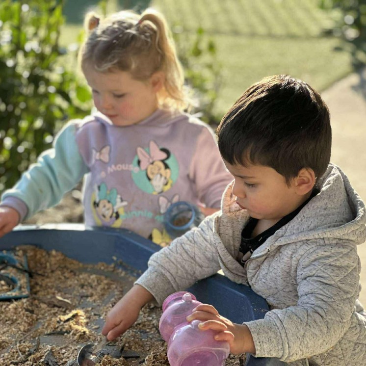 Nature play for preschool boy and girl in busy bees judsons road outdoor area