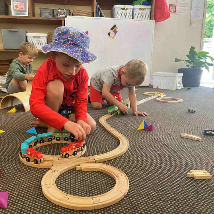 Kindergarten boys playing with trains at Busy Bees Mapua