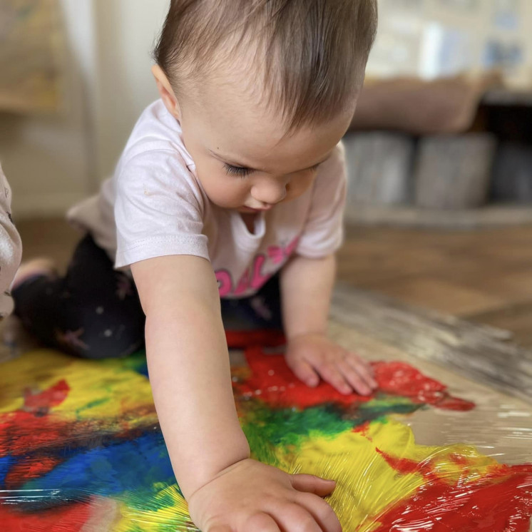 Busy Bees Martinborough baby exploring paint and texture