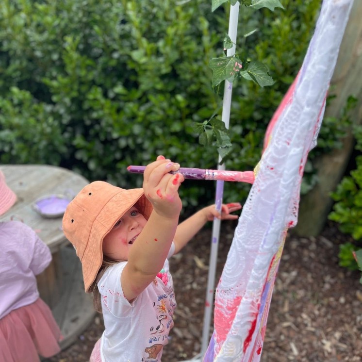Busy Bees Martinborough childcare centre outdoor painting activities for imaginative play