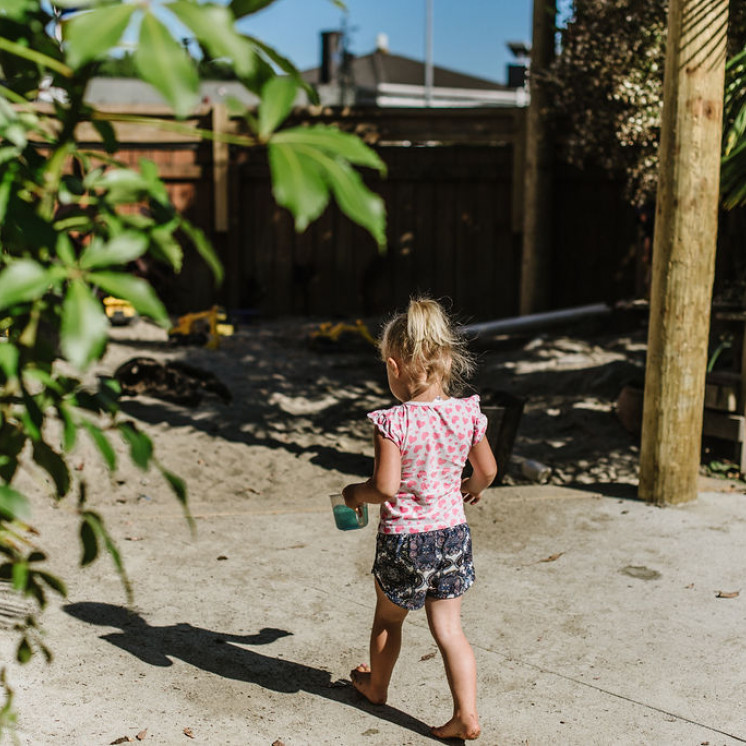 Young kindergarten girl playing in sandpit at Busy Bees Motueka Childcare