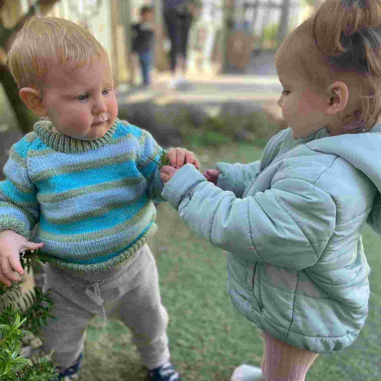 Babys establishing friendships in nursery at Busy Bees New Plymouth 