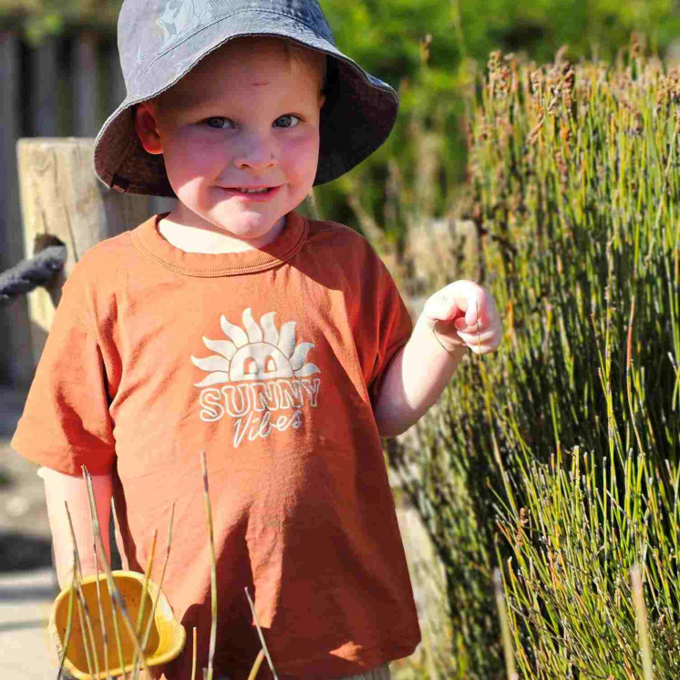 Toddler boy, large outdoor playground at Busy Bees New Plymouth 