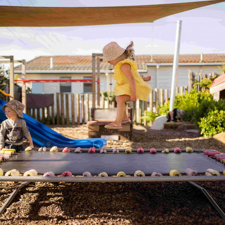 Outdoor fun for preschoolers in large playground at Busy Bees Ngongotahā 