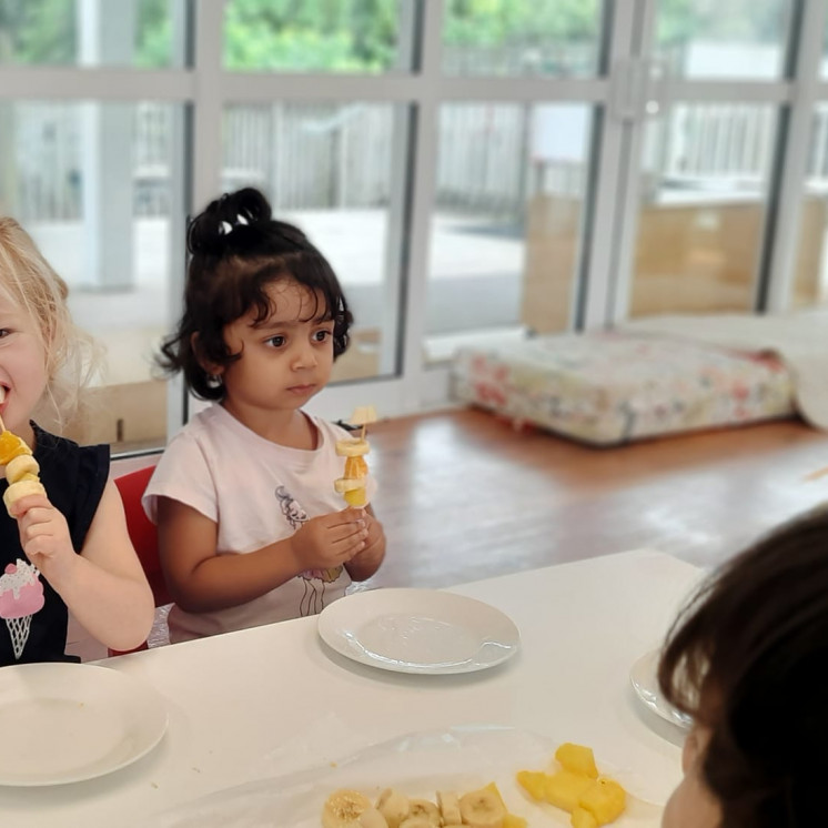 Little ones enjoyed making their own fruit kebabs at Busy Bees Ōtāhuhu
