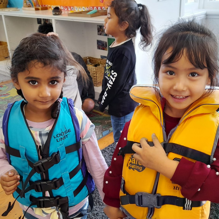 Preschool children got to try on lifejackets during sea week at Busy Bees Ōtāhuhu