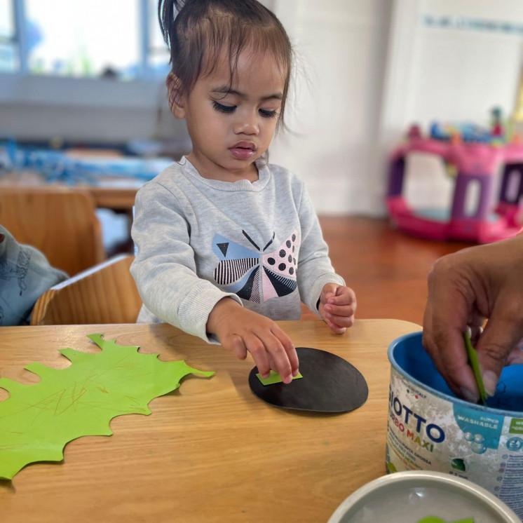 Creating with paper and shapes at Busy Bees Ōtāhuhu