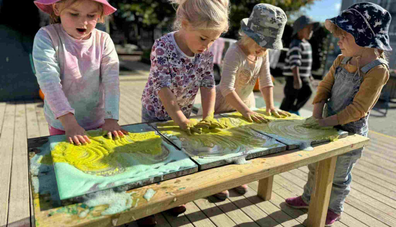 Fun messy play in preschool room at Busy Bees Pahiatua