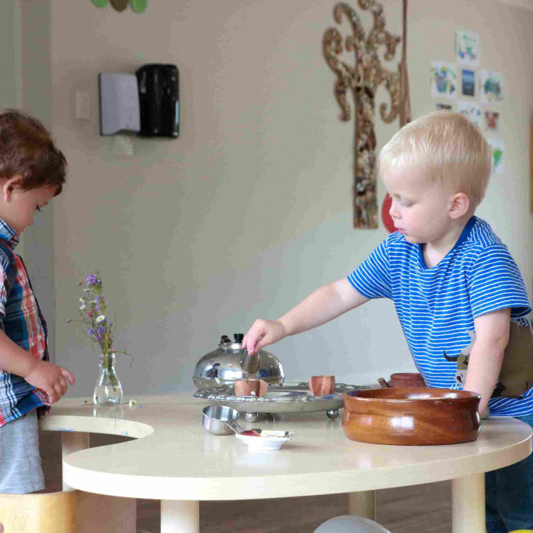 Toddler boys in preschool making friendships at Busy Bees Pahiatua