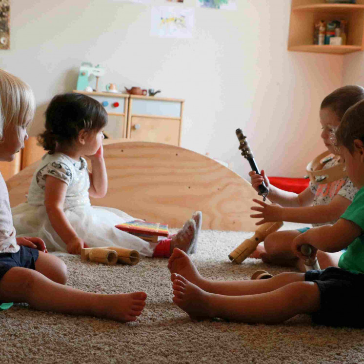 Babys with music and movement in nursery room at Busy Bees Pahiatua