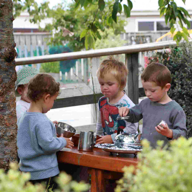 Outdoor gardening in Busy Bees Pahiatua Childcare backyard playground