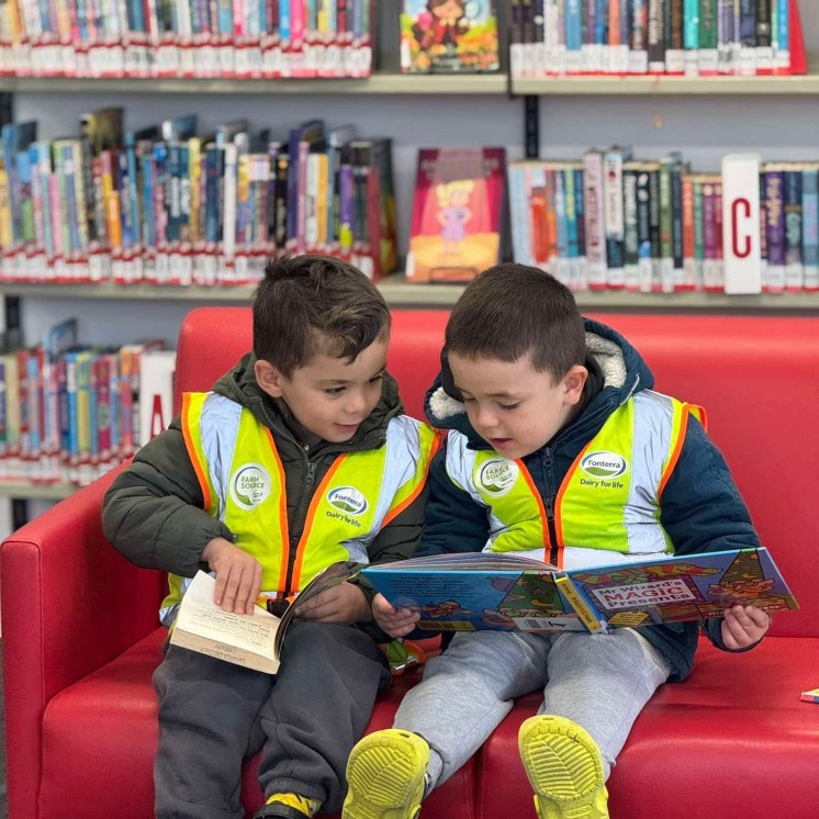 Busy Bees Pahiatua Boys reading book together 