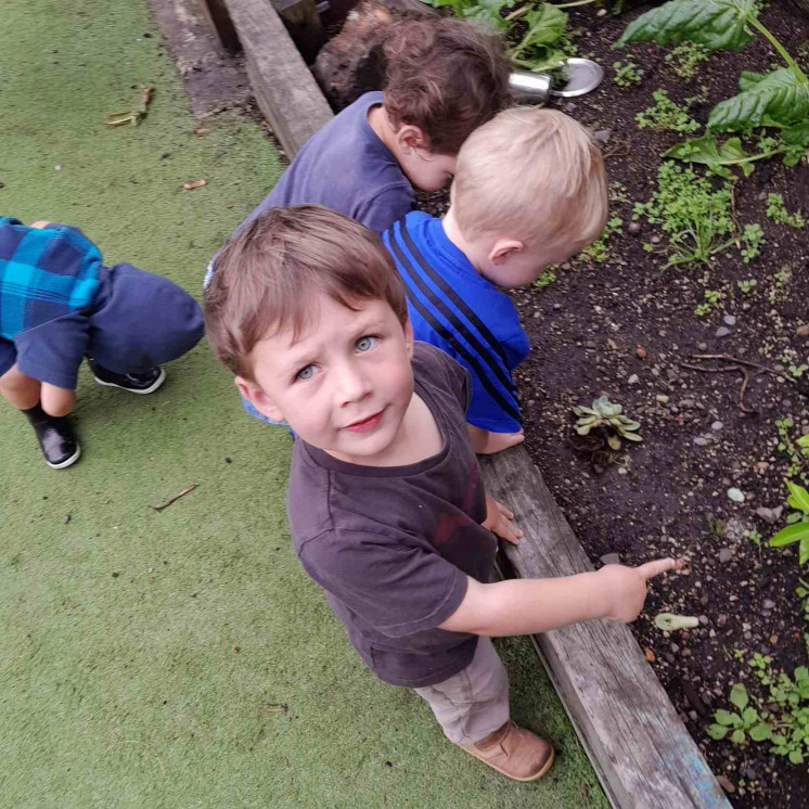 Children caring for the gardens at Busy Bees Papamoa Beach