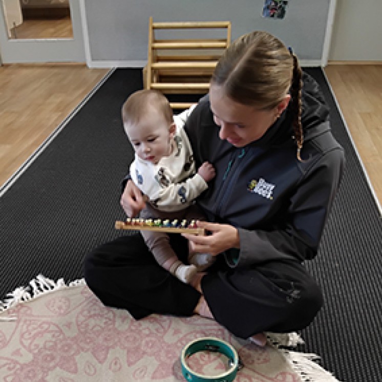 Teacher and Child Baby Infant Nursery one-on-one music