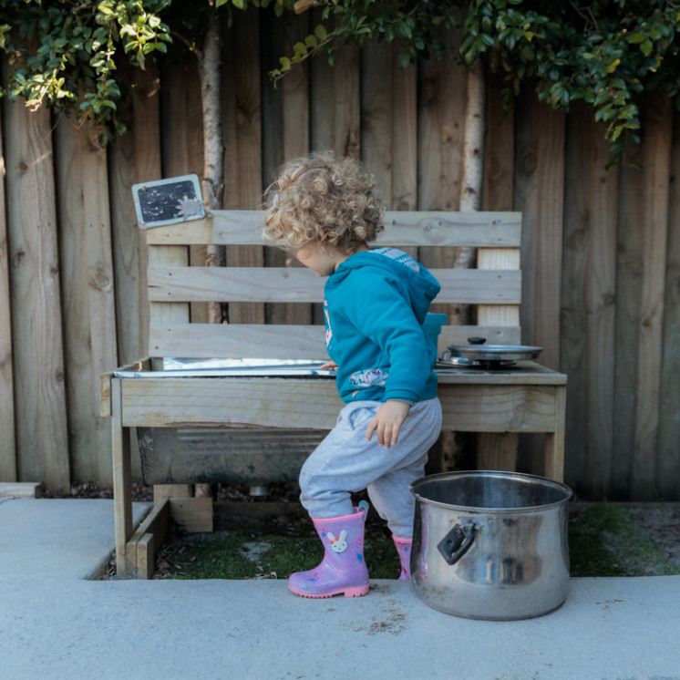 Playing in the Outdoor Kitchen at Busy Bees Pukekohe