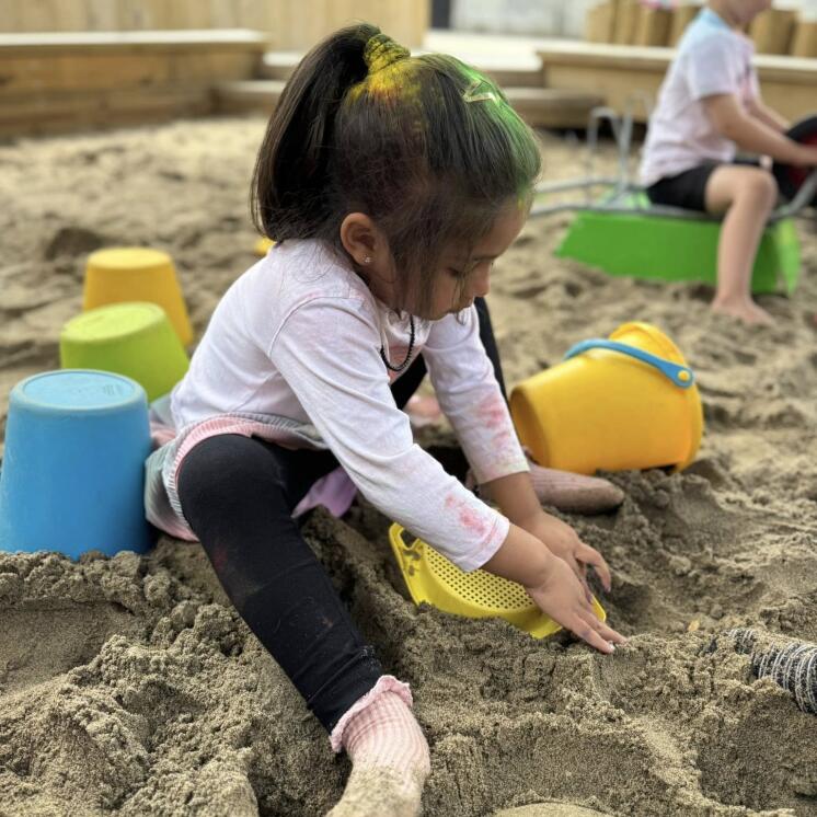 Sandpit playing for Toddlers in Busy Bees Roscommon large outdoor space