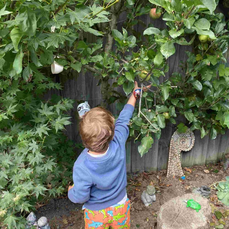Nature play for preschool boy at Busy Bees Southbrook childcare centre