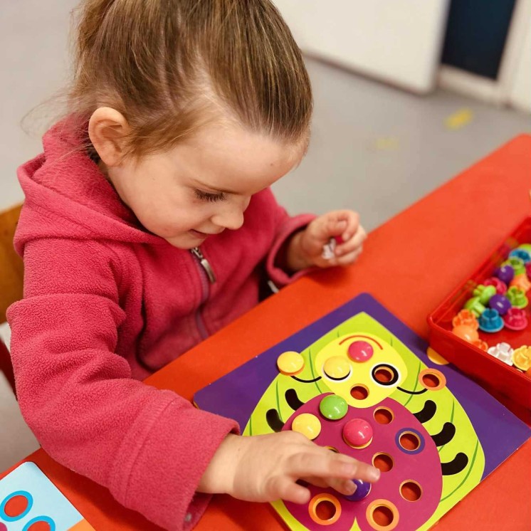 Preschool girl learning fine motor skills at Busy Bees Soutbrook 