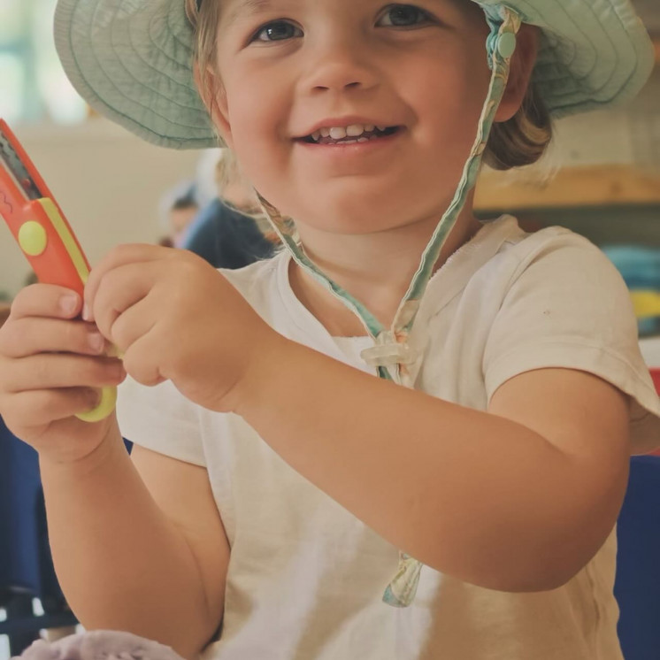 Busy Bees Tahunanui toddler girl big smiles