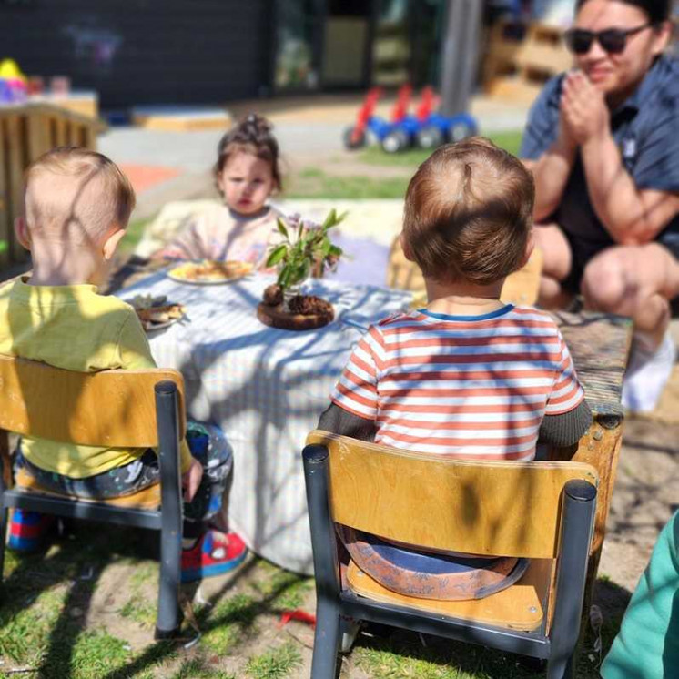 Babies in nursery room eating outdoors at Busy Bees Taupo