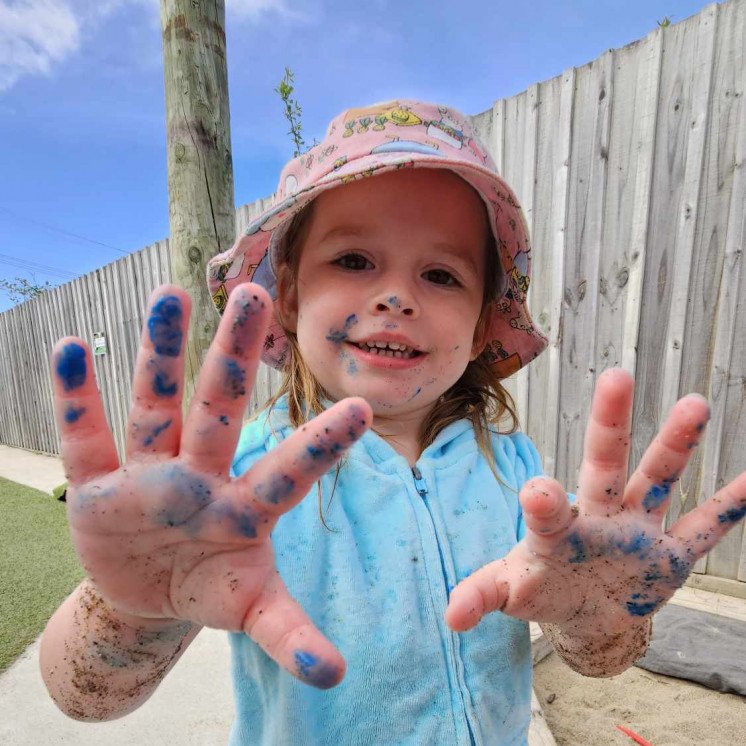 Messy painting play at daycare centre Busy Bees Te Kauwhata