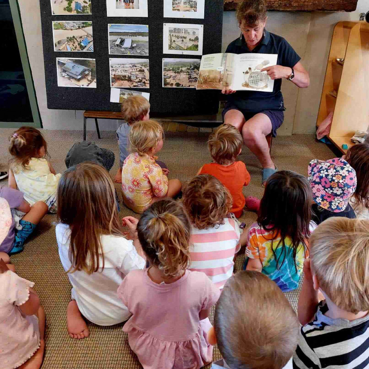 Preschoolers learning at mat time with one of our passionate teachers at Busy Bees Te Mata Road