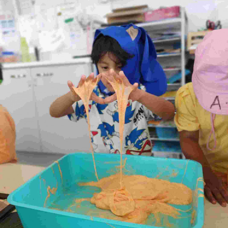 Preschool room in messy play at Te Rapa childcare