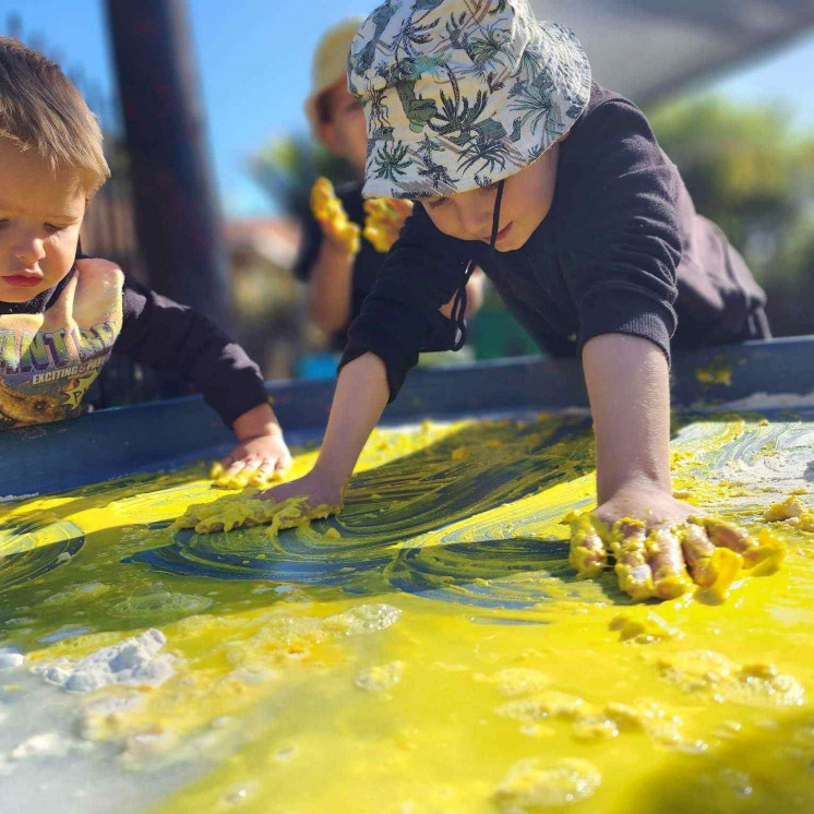 Fun messy play for toddler boys at Busy Bees Whau Valley 